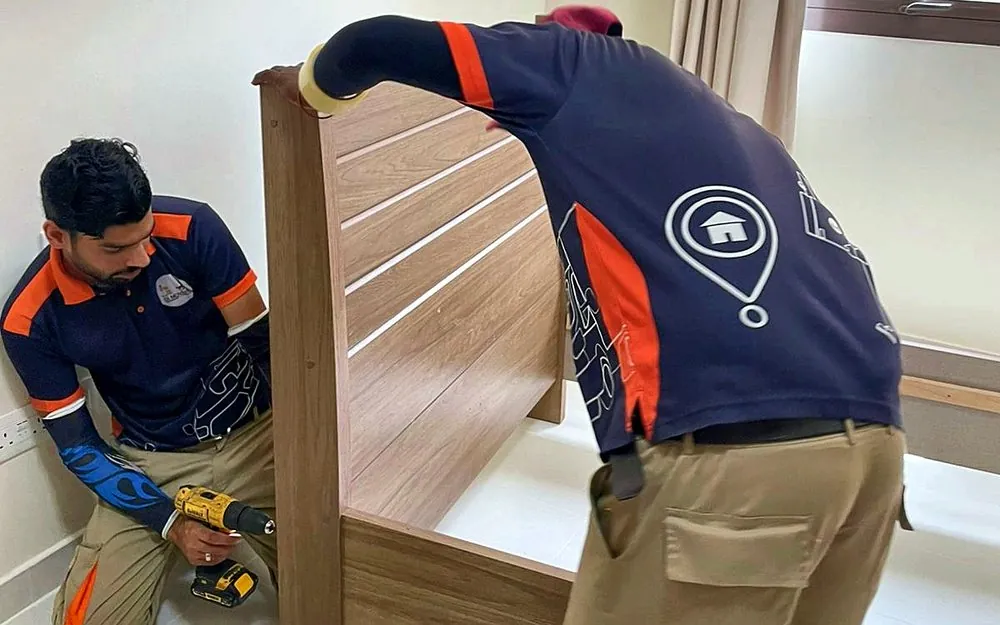 GI Movers crew assembling a bed