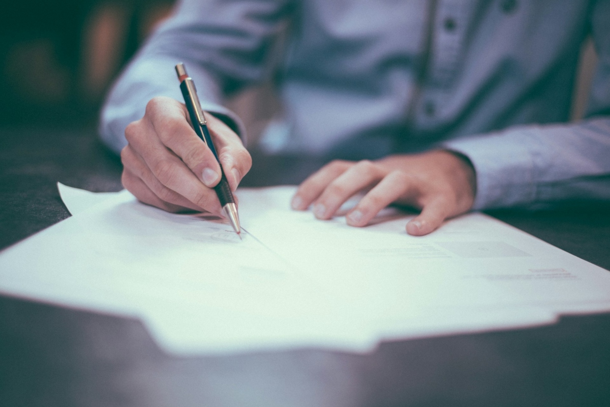 a man signing a doc