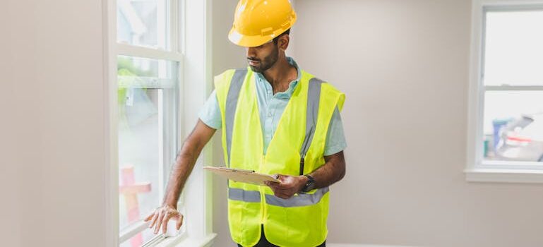 a man checking a window to pet-proof your new home