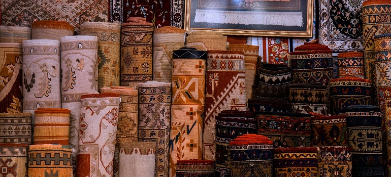 an inside of a moving truck that is moving carpets long distances