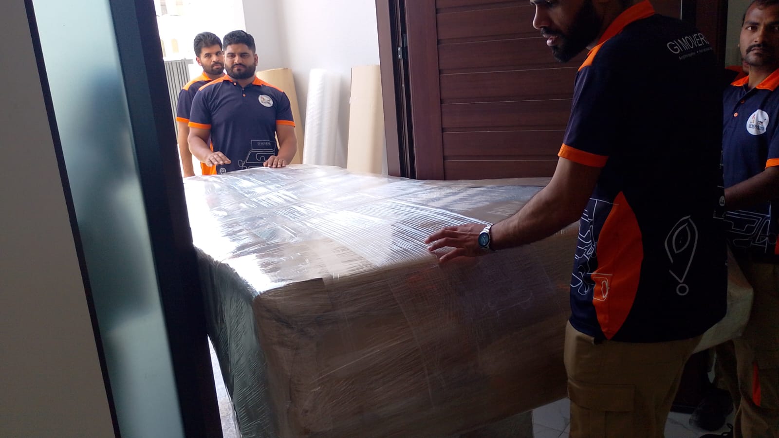 Movers loading furniture for a residential move in Musaffah, Abu Dhabi