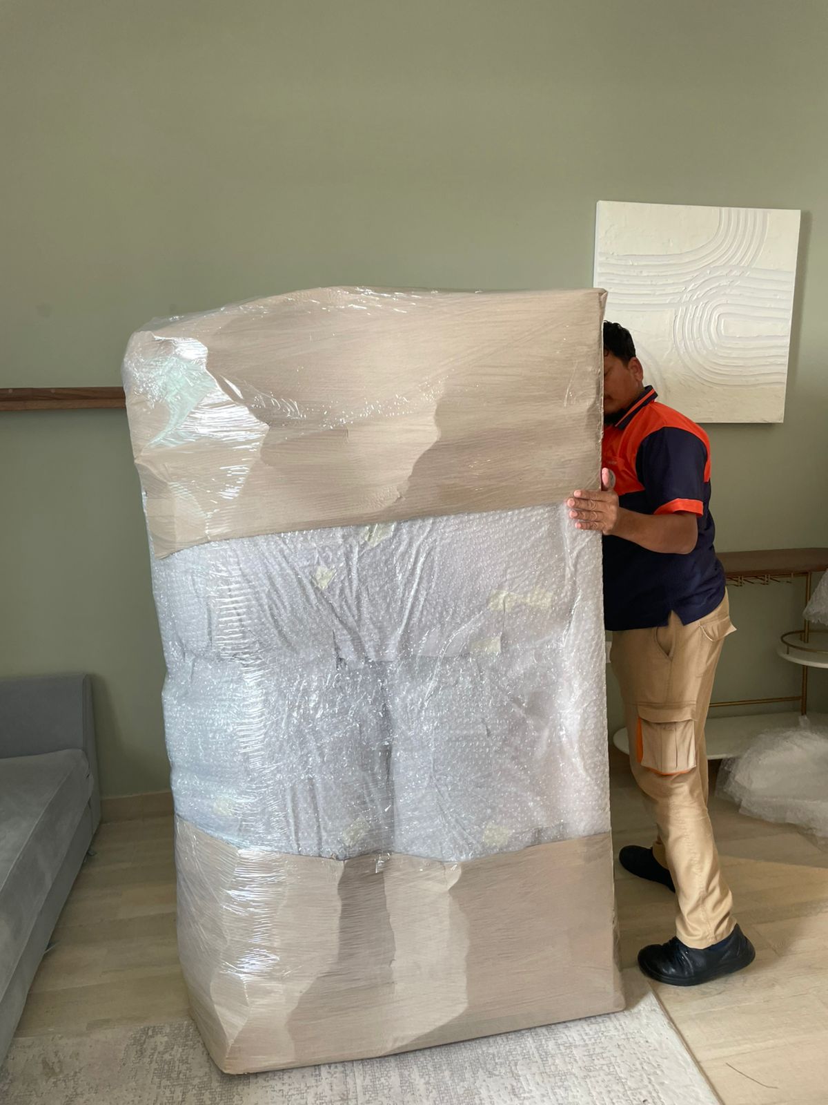 Movers loading furniture for a waterfront apartment move in Al Raha Beach