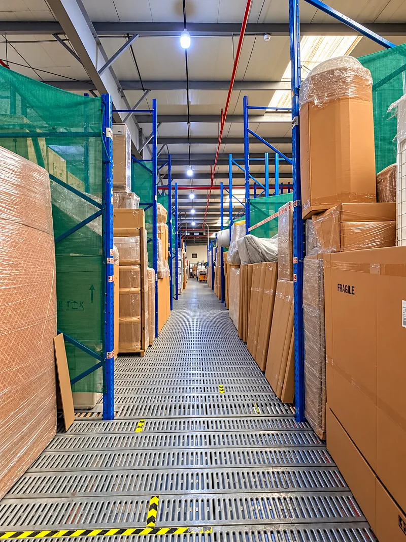Clean aisle between storage racks in the GI Movers warehouse