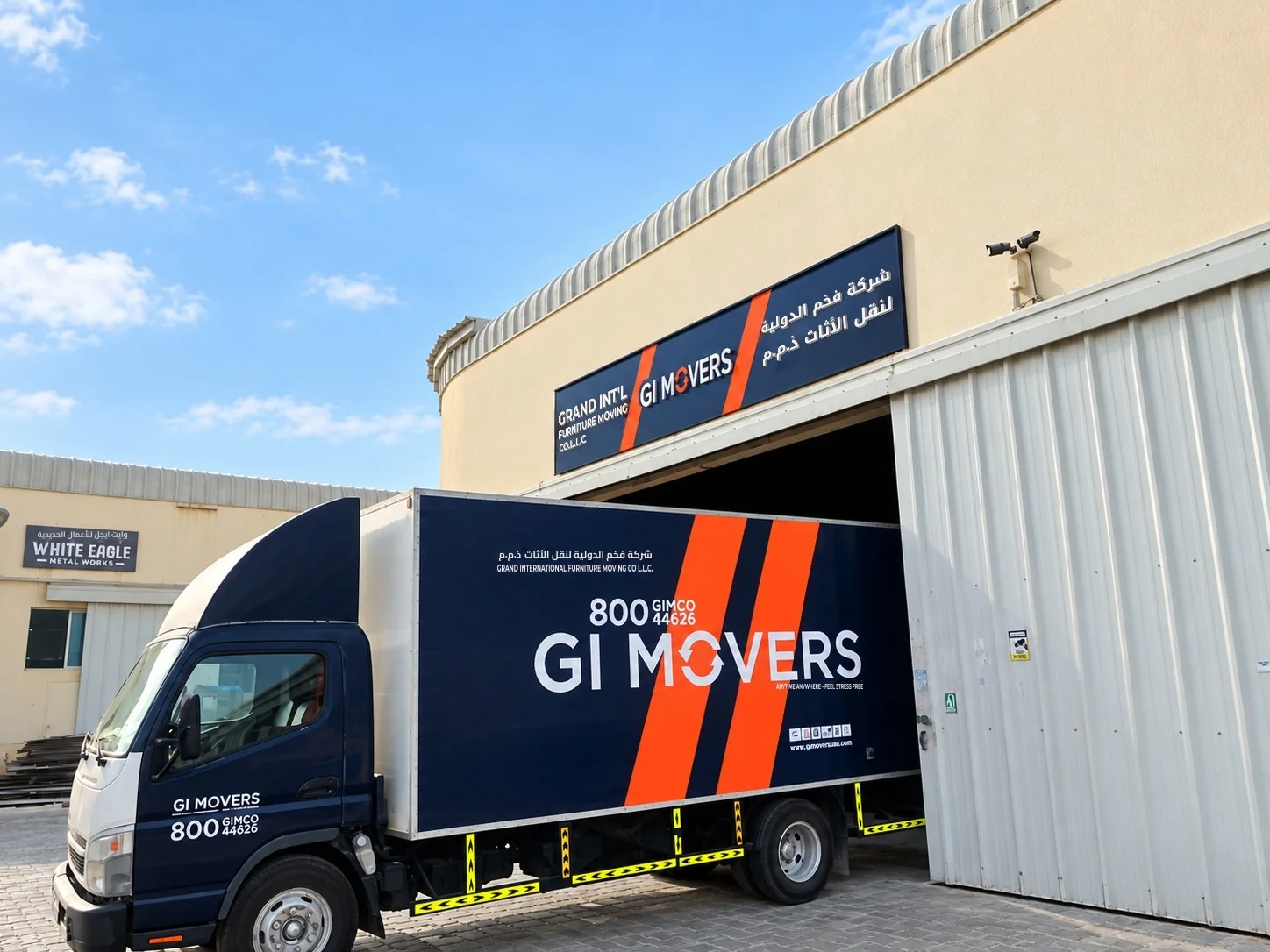 GI Movers storage warehouse in Musaffah, Abu Dhabi, with a GI Movers truck at the loading bay